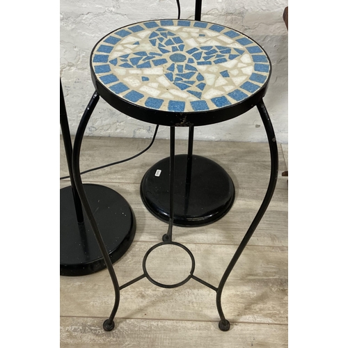 85 - Four items, one teak folding outdoor side table, one black wrought metal and mosaic top circular pla... 