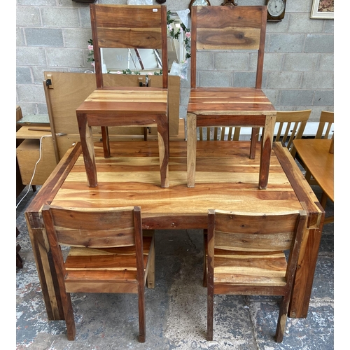 86 - An Indian sheesham wood rectangular dining table and four chairs - approx. 76cm high x 89cm wide x 1... 