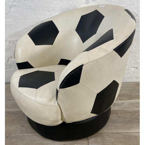 87 - A Relaxation black and white leatherette swivel football chair - approx. 71cm high