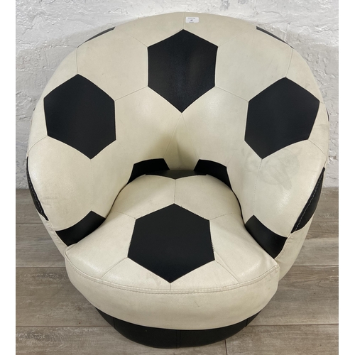 87 - A Relaxation black and white leatherette swivel football chair - approx. 71cm high