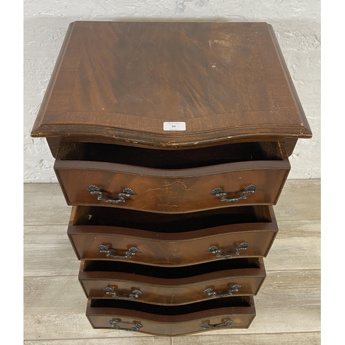 89 - A mahogany serpentine miniature chest of drawers on bracket supports - approx. 71cm high x 48cm wide... 