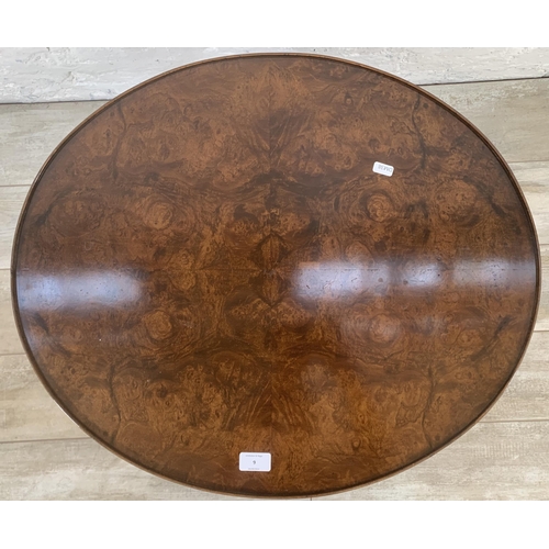 9 - An Art Deco style burr walnut and rattan oval two tier side table - approx. 56cm high x 56cm wide x ... 