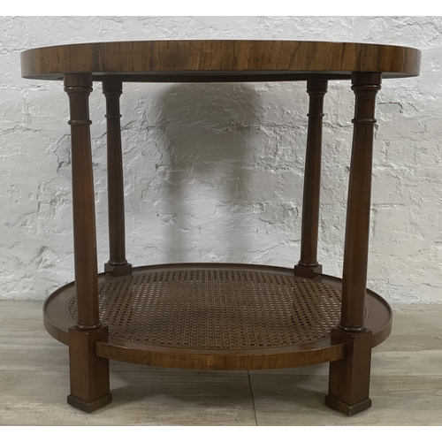 9 - An Art Deco style burr walnut and rattan oval two tier side table - approx. 56cm high x 56cm wide x ... 