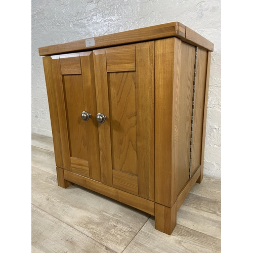 91 - A modern oak two door storage/media cabinet - approx. 59cm high x 56cm wide x 40cm deep