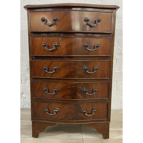 94 - A mahogany serpentine miniature chest of drawers on bracket supports - approx. 70cm high x 45cm wide... 