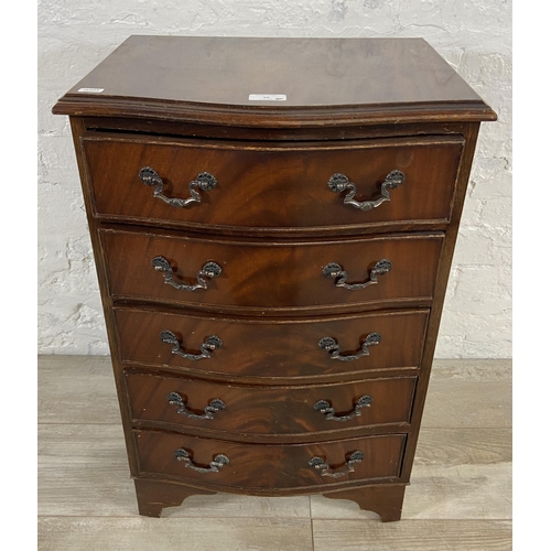 94 - A mahogany serpentine miniature chest of drawers on bracket supports - approx. 70cm high x 45cm wide... 