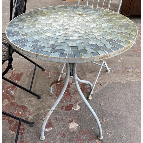 98 - Five pieces of garden furniture, two black metal and mosaic folding chairs, two grey painted metal f... 