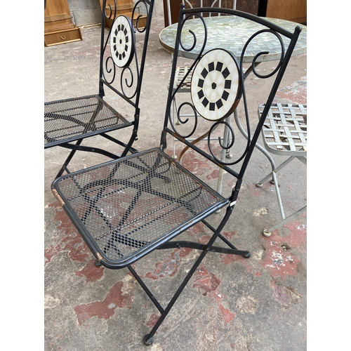 98 - Five pieces of garden furniture, two black metal and mosaic folding chairs, two grey painted metal f... 