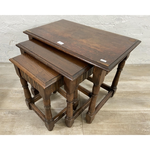 167 - Two pieces of oak furniture, one nest of tables and one barley twist stool