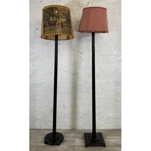 38A - Two mid 20th century ebonised floor standing lamps, each approx. 157cm high