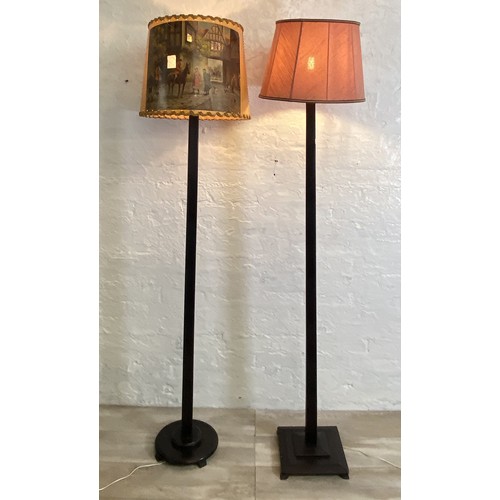 38A - Two mid 20th century ebonised floor standing lamps, each approx. 157cm high