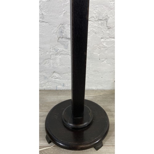 38A - Two mid 20th century ebonised floor standing lamps, each approx. 157cm high