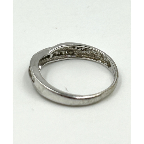 2137 - A hallmarked 9ct white gold diamond half eternity crossover ring, size N - approx. gross weight 2.3g