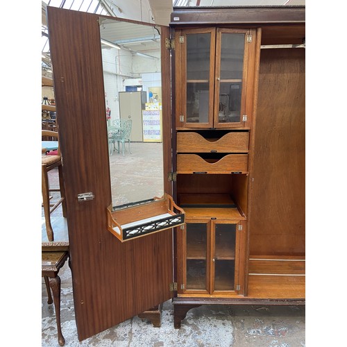 147 - A 1920s mahogany gentleman's compactum double wardrobe with fitted interior - approx. 181cm high x 1... 