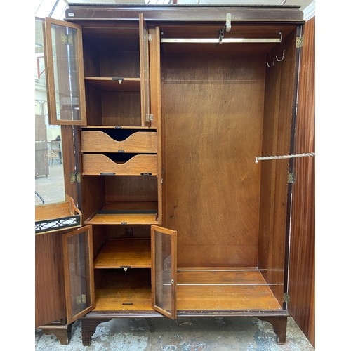 147 - A 1920s mahogany gentleman's compactum double wardrobe with fitted interior - approx. 181cm high x 1... 