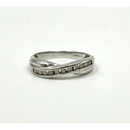 2137 - A hallmarked 9ct white gold diamond half eternity crossover ring, size N - approx. gross weight 2.3g