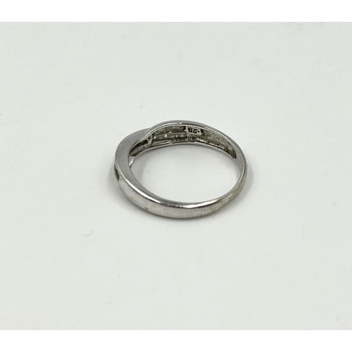 2137 - A hallmarked 9ct white gold diamond half eternity crossover ring, size N - approx. gross weight 2.3g