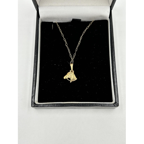 2110 - Two pieces of jewellery, one 9ct gold horse head pendant necklace - approx. gross weight 0.5g and on... 