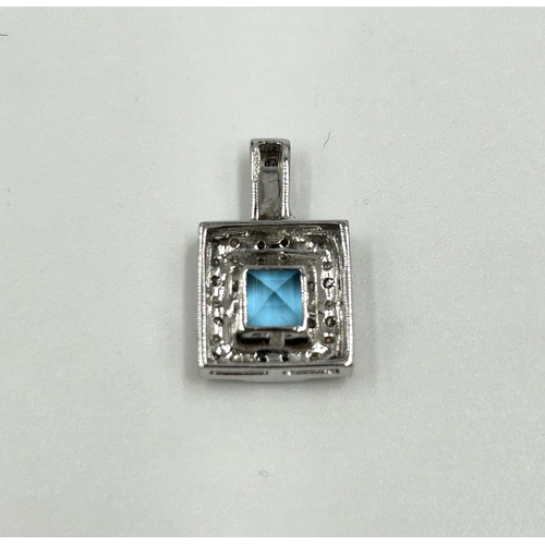 2111 - A 9ct white gold blue topaz and diamond pendant with certificate - approx. gross weight 1.9g