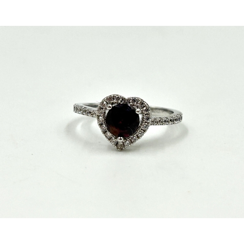 2120 - An 18ct white gold garnet and CZ heart shaped dress ring, size O - approx. gross weight 2.1g