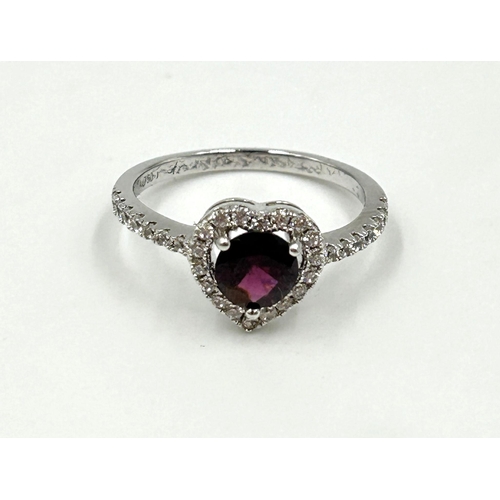 2120 - An 18ct white gold garnet and CZ heart shaped dress ring, size O - approx. gross weight 2.1g