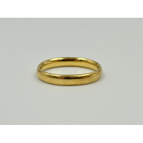 2145 - A hallmarked Birmingham 22ct gold wedding band, size J - approx. gross weight 3.5g