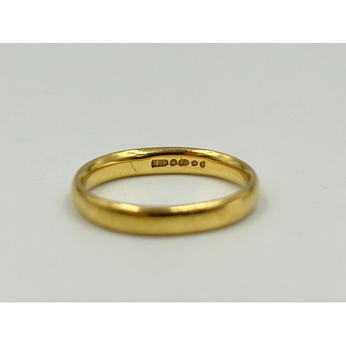 2145 - A hallmarked Birmingham 22ct gold wedding band, size J - approx. gross weight 3.5g