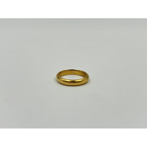 2148 - A 22ct gold wedding band, size M - approx. gross weight 5.2g