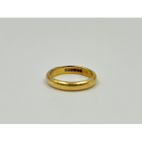 2148 - A 22ct gold wedding band, size M - approx. gross weight 5.2g