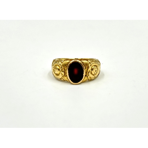 2150 - A yellow metal red stone set solitaire ring, size M - approx. gross weight 10.6g