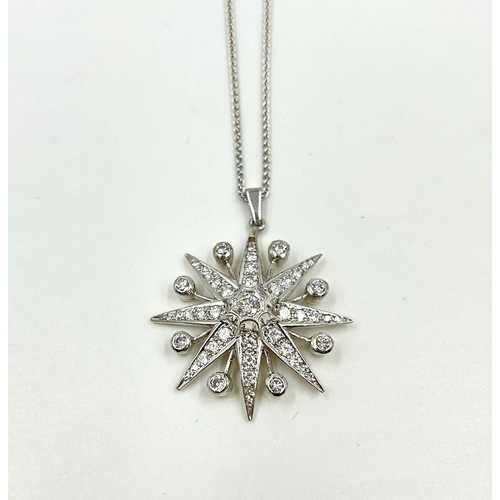 2156 - A hallmarked 18ct white gold diamond set star pendant necklace with central round brilliant cut diam... 