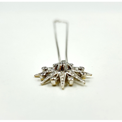 2156 - A hallmarked 18ct white gold diamond set star pendant necklace with central round brilliant cut diam... 