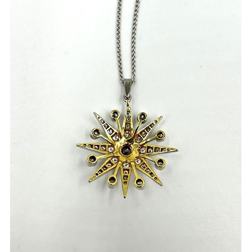 2156 - A hallmarked 18ct white gold diamond set star pendant necklace with central round brilliant cut diam... 