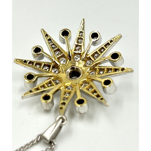 2156 - A hallmarked 18ct white gold diamond set star pendant necklace with central round brilliant cut diam... 