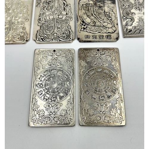 2224 - Six Chinese Tibetan Silver embossed amulets - approx. gross weight 828g and largest approx. 10cm hig... 