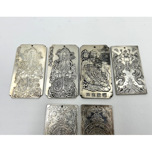 2224 - Six Chinese Tibetan Silver embossed amulets - approx. gross weight 828g and largest approx. 10cm hig... 