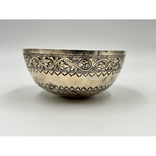 2226 - A Middle Eastern white metal embossed bowl - approx. 4.5cm high x 11cm diameter and approx. gross we... 