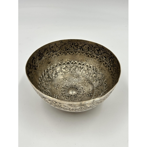 2226 - A Middle Eastern white metal embossed bowl - approx. 4.5cm high x 11cm diameter and approx. gross we... 