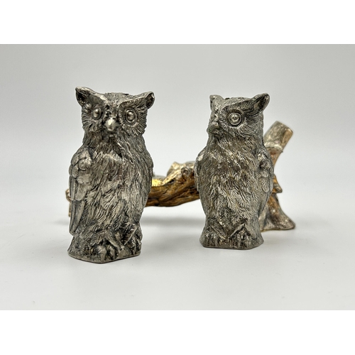 2234 - Two vintage white metal owl shaped pepper pots on tree branch stand - approx. 11cm high x 12cm wide