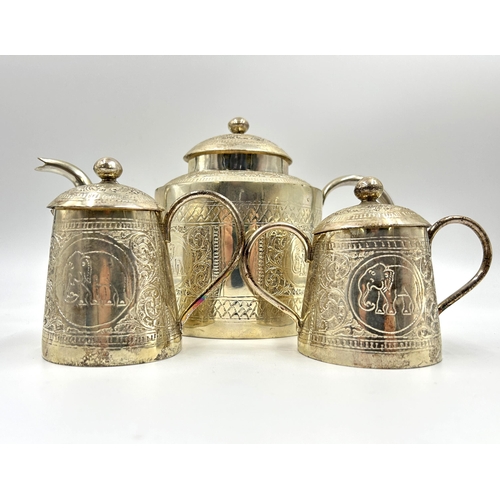 2244 - An Indian white metal four piece tea set with engraved elephant design - approx. gross weight 1026g