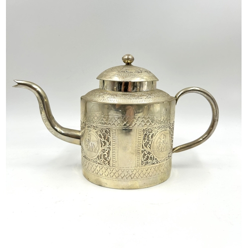 2244 - An Indian white metal four piece tea set with engraved elephant design - approx. gross weight 1026g