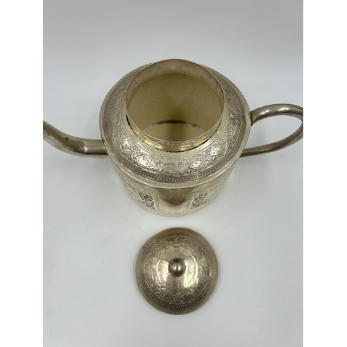 2244 - An Indian white metal four piece tea set with engraved elephant design - approx. gross weight 1026g