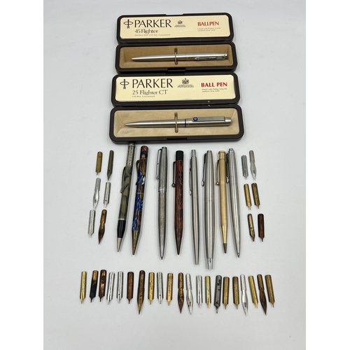 2264 - A collection of writing instruments and accessories to include two Parker retractable ballpoint pens... 