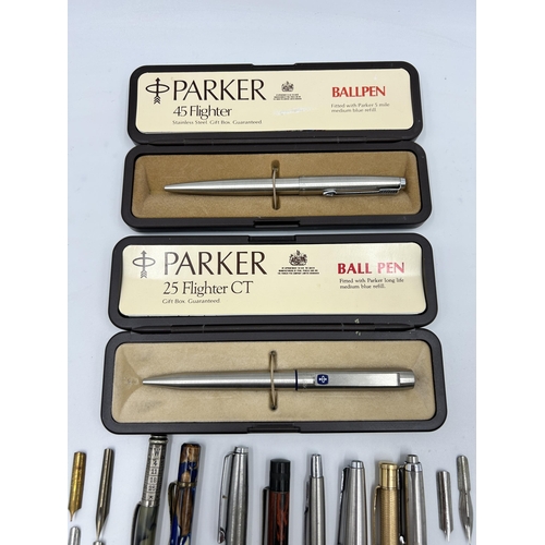 2264 - A collection of writing instruments and accessories to include two Parker retractable ballpoint pens... 