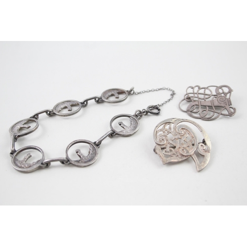 2106 - Three pieces of Celtic sterling silver jewellery, one Ola Gorie brooch, one Shetland brooch and one ... 