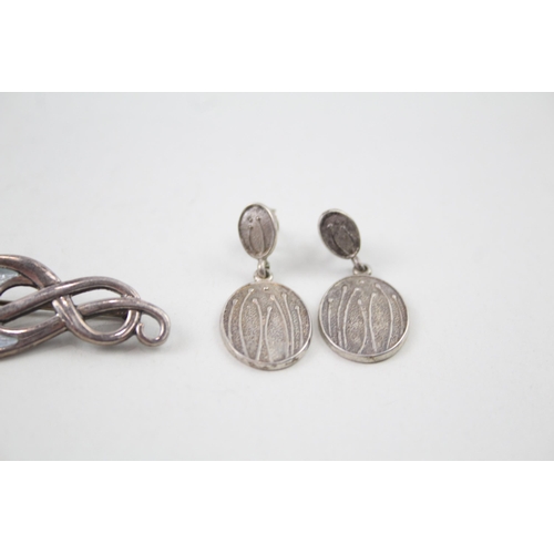 2109 - Three pieces of sterling silver jewellery, two Malcolm Gray for Ortak brooches and one pair of Ola G... 