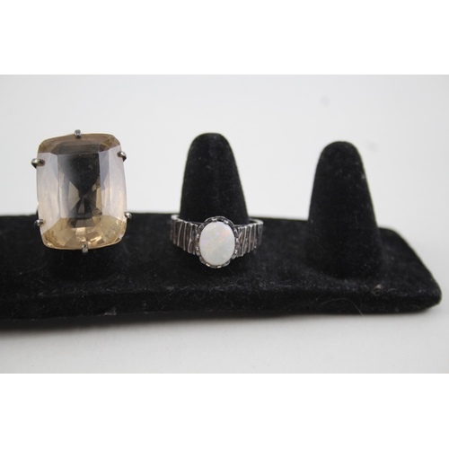 2111 - Four sterling silver gemstone set rings to include opal, lapis lazuli etc. - approx. gross weight 29... 