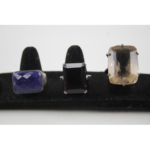 2111 - Four sterling silver gemstone set rings to include opal, lapis lazuli etc. - approx. gross weight 29... 