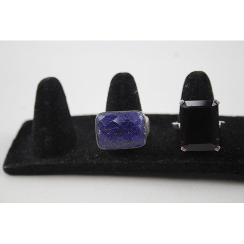 2111 - Four sterling silver gemstone set rings to include opal, lapis lazuli etc. - approx. gross weight 29... 