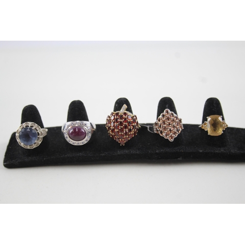 2118 - Five sterling silver gemstone set rings to include ruby, garnet, citrine etc. - approx. gross weight... 